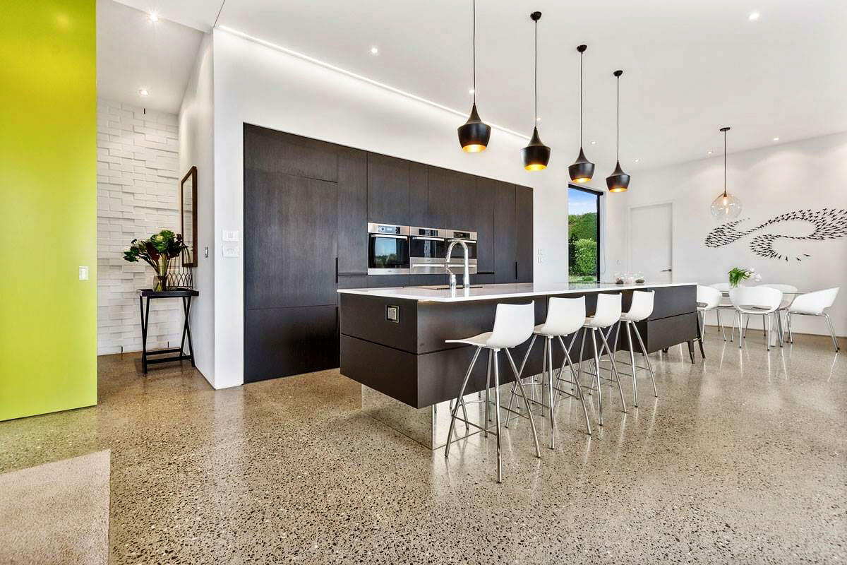 Highly polished concrete floor with a deep grind exposing the aggregate.