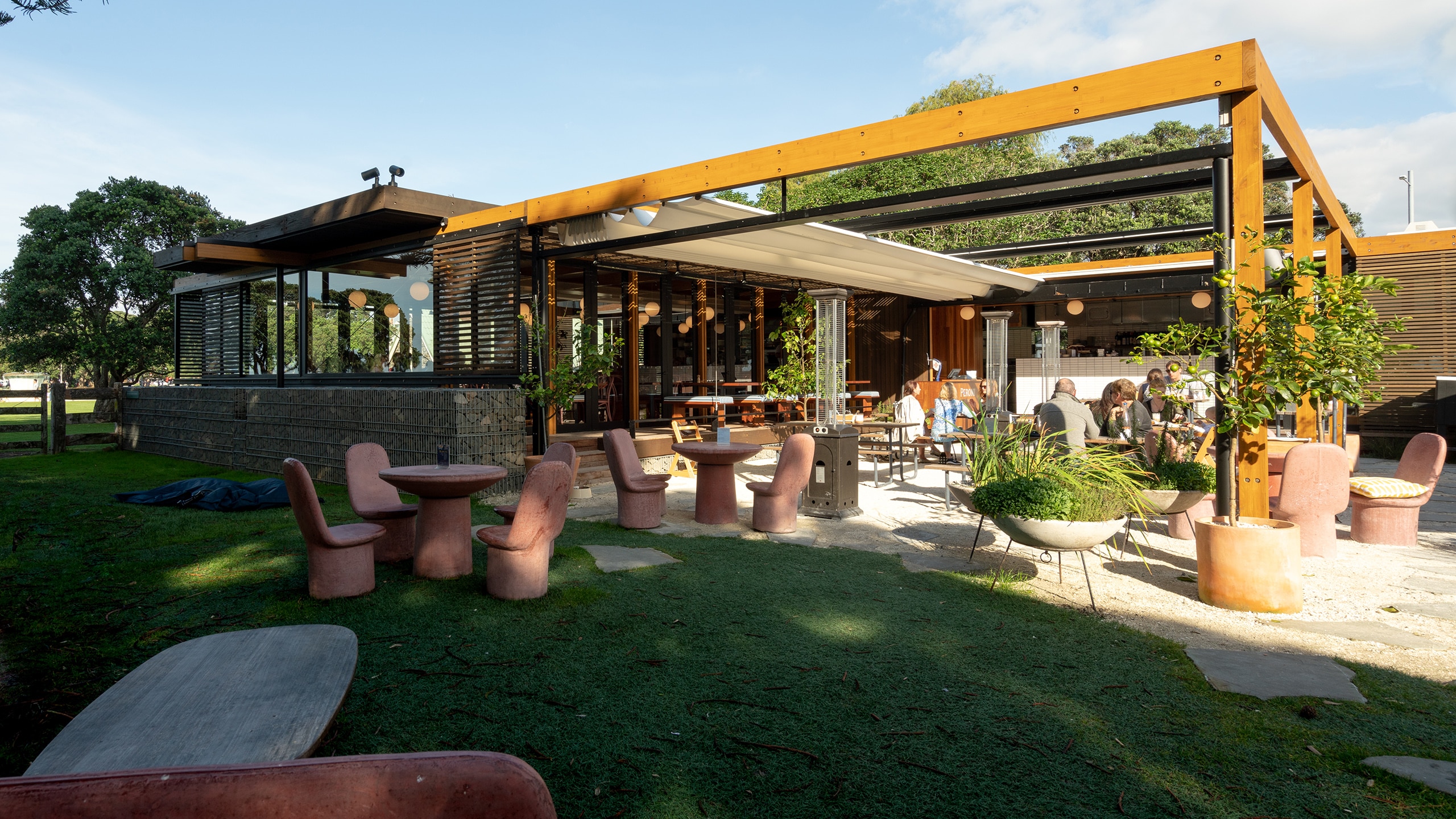 Coloured concrete chairs and tables in Mission Bay Auckland.