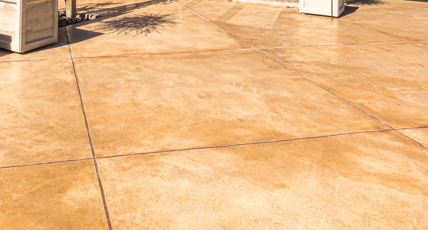 coloured-concrete-grout-finish coloured concrete with contrasting grout filling decorative cuts