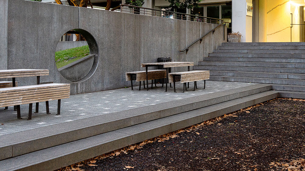 coloured-concrete-public-space-design-example-Hurstmere-Road-park Coloured concrete stairs and wall in a public park