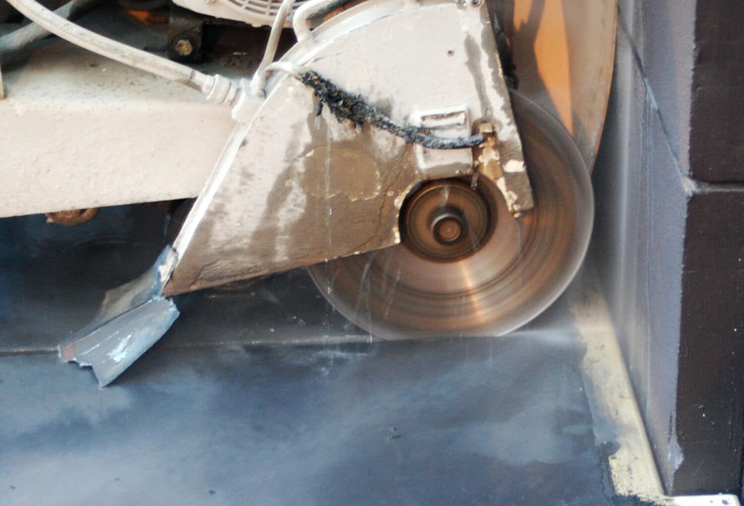 concrete-cutting cutting concrete before filling with grout