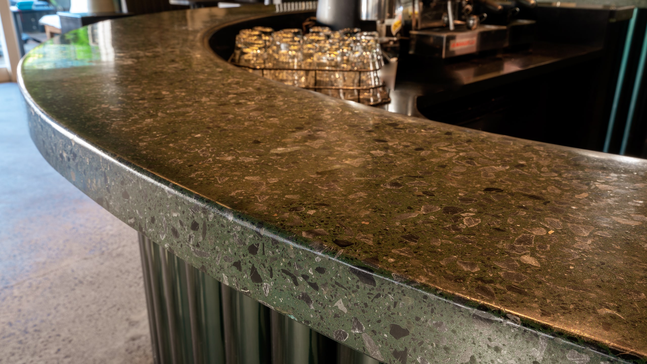 custom colour green, longroom, concrete bar and counter, close up polished concrete bar top