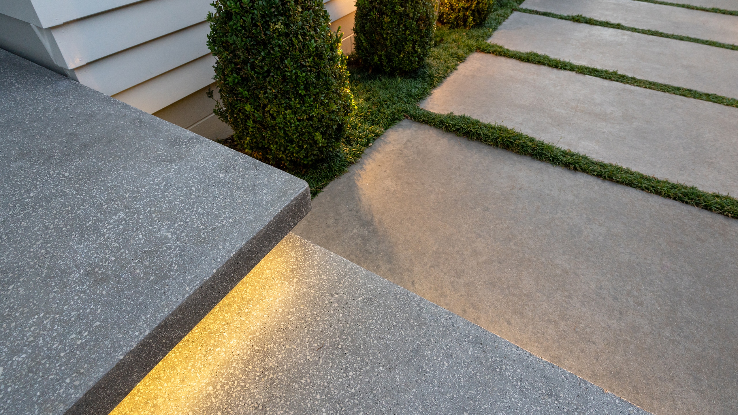 coloured concrete paths in manicured garden